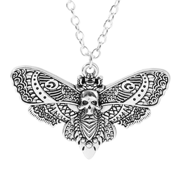 Jewelry - Skull moth earrings representing resilience